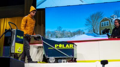 Student pushing a Polar cart