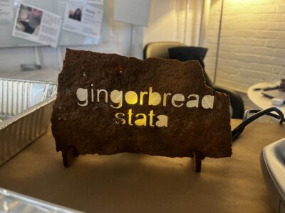 picture of a piece of gingerbread with "gingerbread stata" cut out of it
