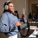 Students talking in a hallway.