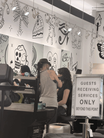 a girl getting her ear's pierced