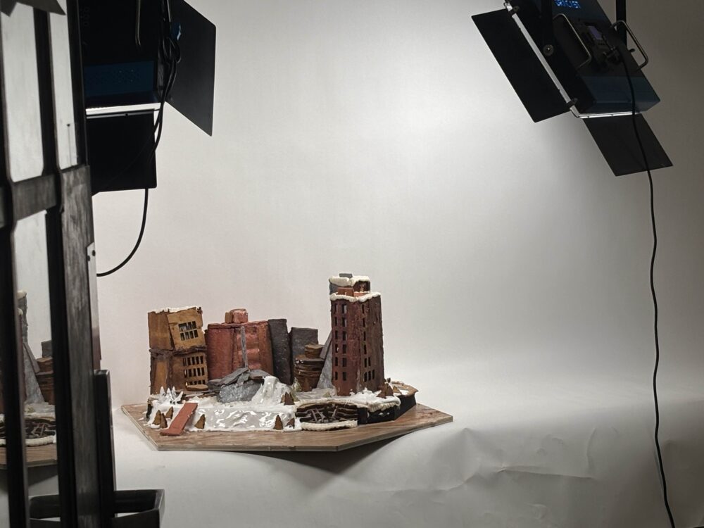 a gingerbread structure in a photo room