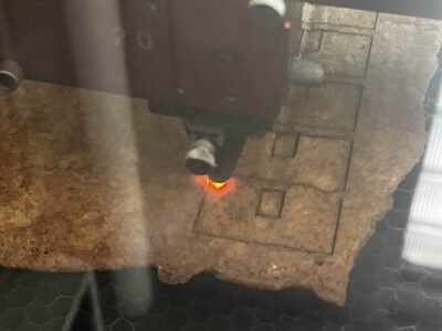 picture of a laser cutter cutting shapes out of gingerbread