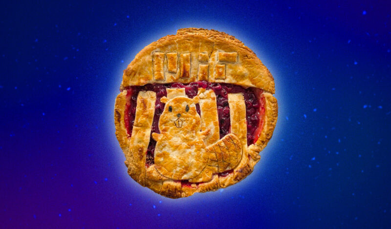 A cranberry pie featuring the MIT Great Dome and Tim the Beaver made out of crust.