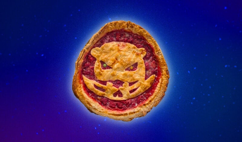 A raspberry pie with a fierce looking beaver made out of crust, the logo for MIT Athletics.