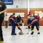 Students playing hockey.