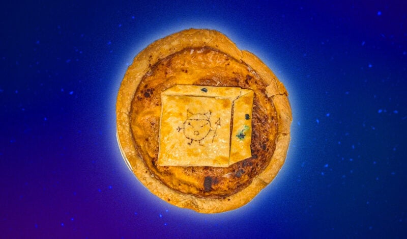 A pie with a milk filling and a cube mascot made of crust on top (Ozok, the dorm mascot of Random Hall).