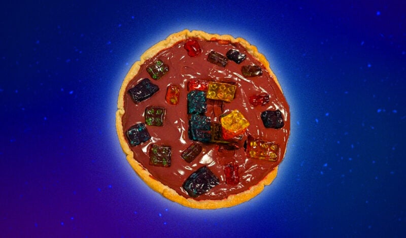A red pudding pie with brick gummies on top, including those in a model of the MacGregor dorm.