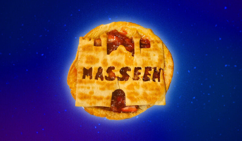 A strawberry pie with a castle made of crust that spells 