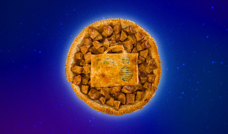 An apple pie with a cutout radio chunk of crust in the center.