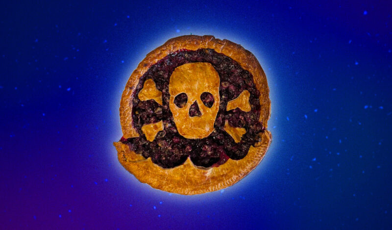 A blueberry pie with a skull and crossbones made of crust on top.