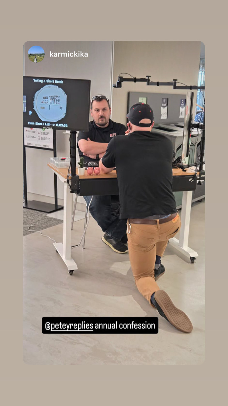 a photo of the author on one knee in front of another blogger at an event 
