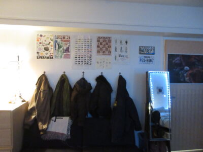 a coat wall and couch