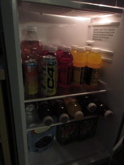 a mini fridge full of vitamin water