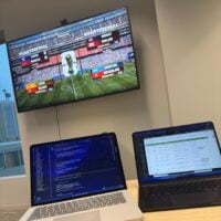 Image of World Cup playing on tv in a lounge
