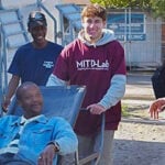 Students working with people outside