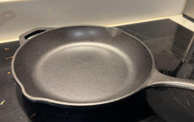 a beautiful cast iron pan sitting atop the stove