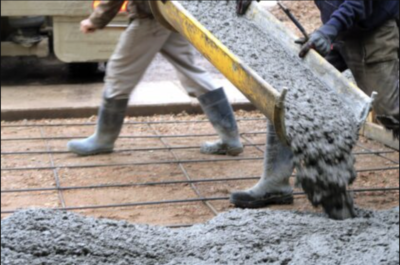 Person pouring wet cement