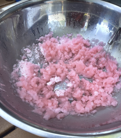 Pink slush in a metal bowl