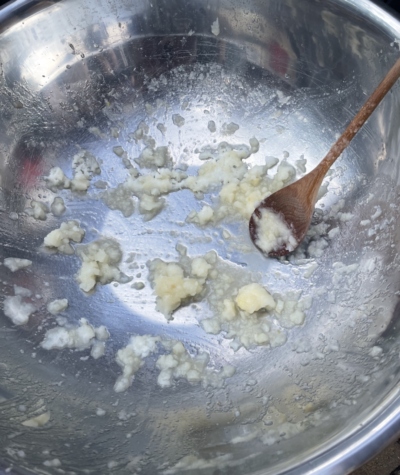 Frozen pear chunks at the bottom of a metal bowl