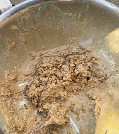 Brown ice cream in a metal bowl