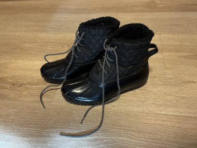 black winter boots on the floor