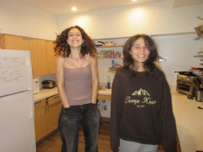 two smiling and jumping girls