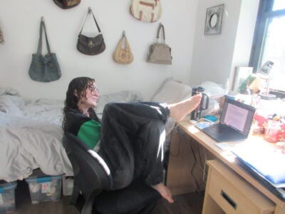 a roommate at her desk