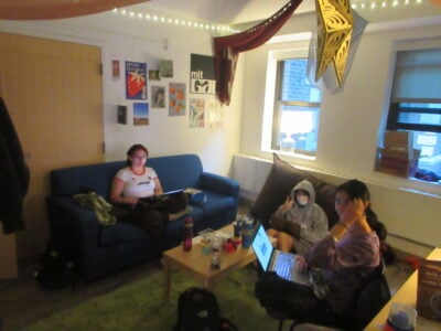 three people sitting in a suite