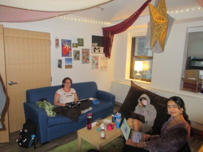 three people sitting in a suite