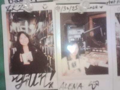 two polaroids pinned up on photo wall in WMBR