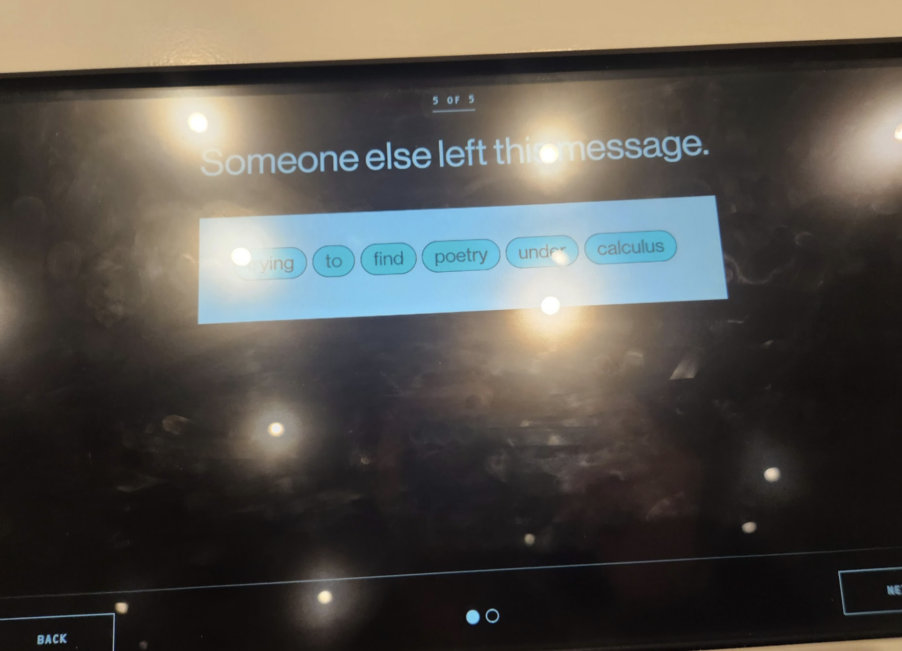 A TV screen with the words "Someone else left this message: trying to find poetry under calculus"