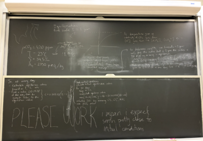 chalkboard with lots of thinking written out about how to solve the problem. words "PLEASE WORK" in all caps.