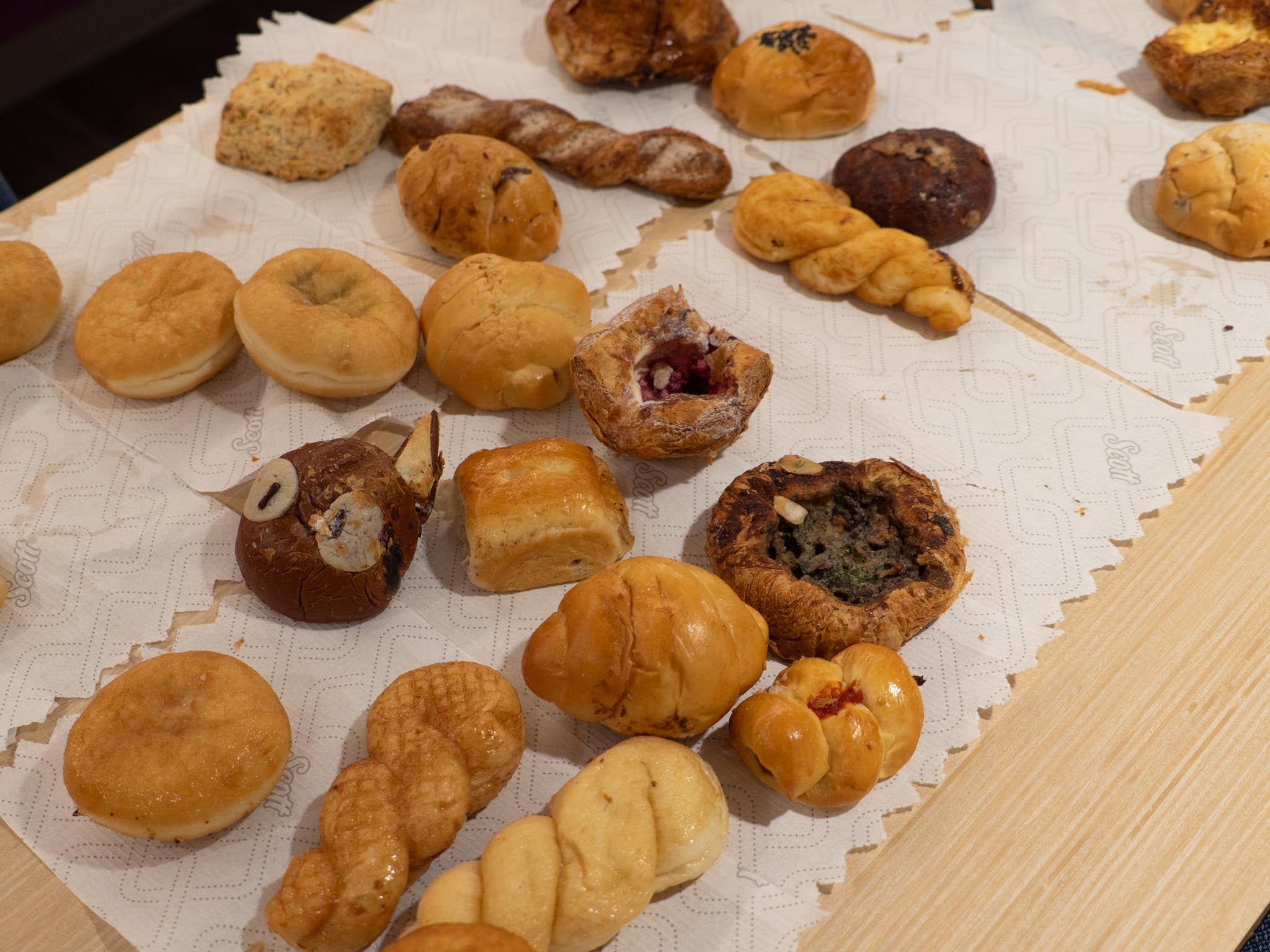 assortment of pastries laid out on paper towels